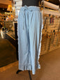 Lightweight denim shorts with frayed edges, elastic drawstring waist, from Ivy's Gifts & Boutique.