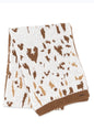 Cow print scarf from Ivy's Gifts & Boutique in lightweight sweater material, featuring a cozy and stylish design.
