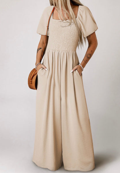 Ivy's Gifts & Boutique ML11 wide-leg jumpsuit with puff sleeves and elastic bodice, shown on a model.