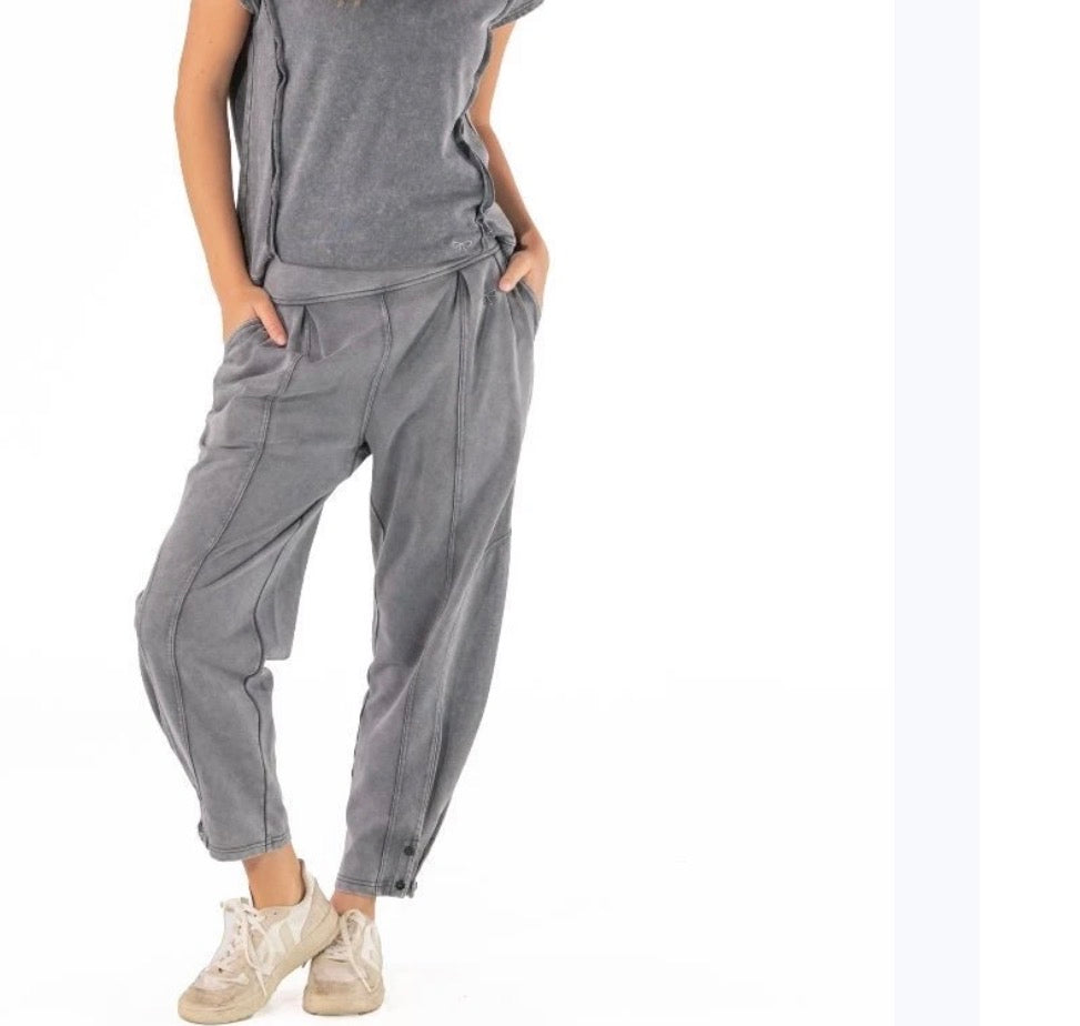Black washed "lived in" look pants with cute ankle buttons from Ivy's Gifts & Boutique, showing relaxed fit and distressed details.