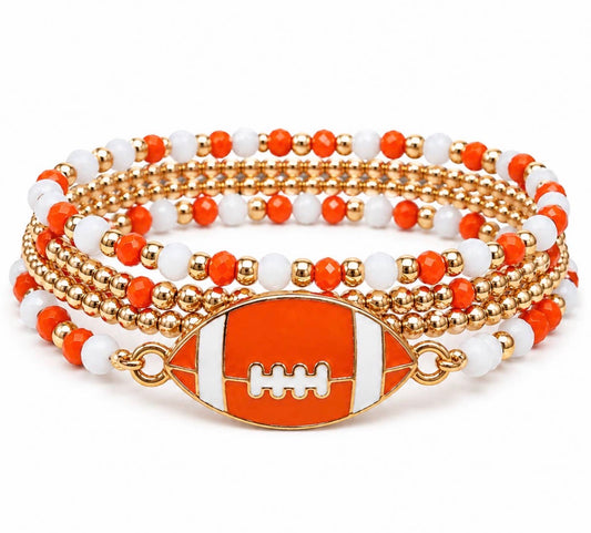 Stack of four TN58 orange and white beaded football bracelets by Ivy's Gifts & Boutique, featuring sporty, colorful bead designs.