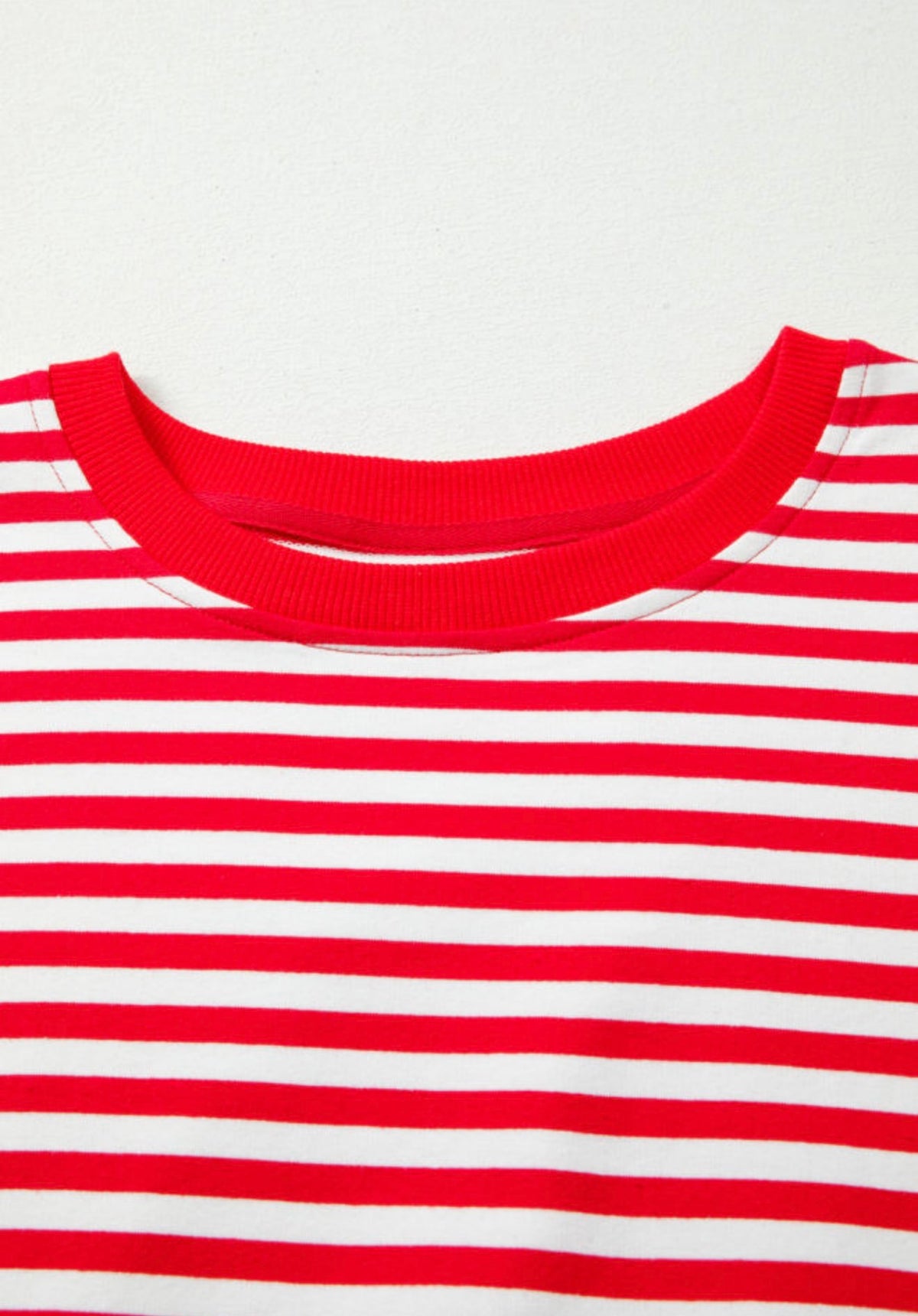 Ivy's Gifts & Boutique red and white striped long sleeve top with raw edges and square patch detail on the back.