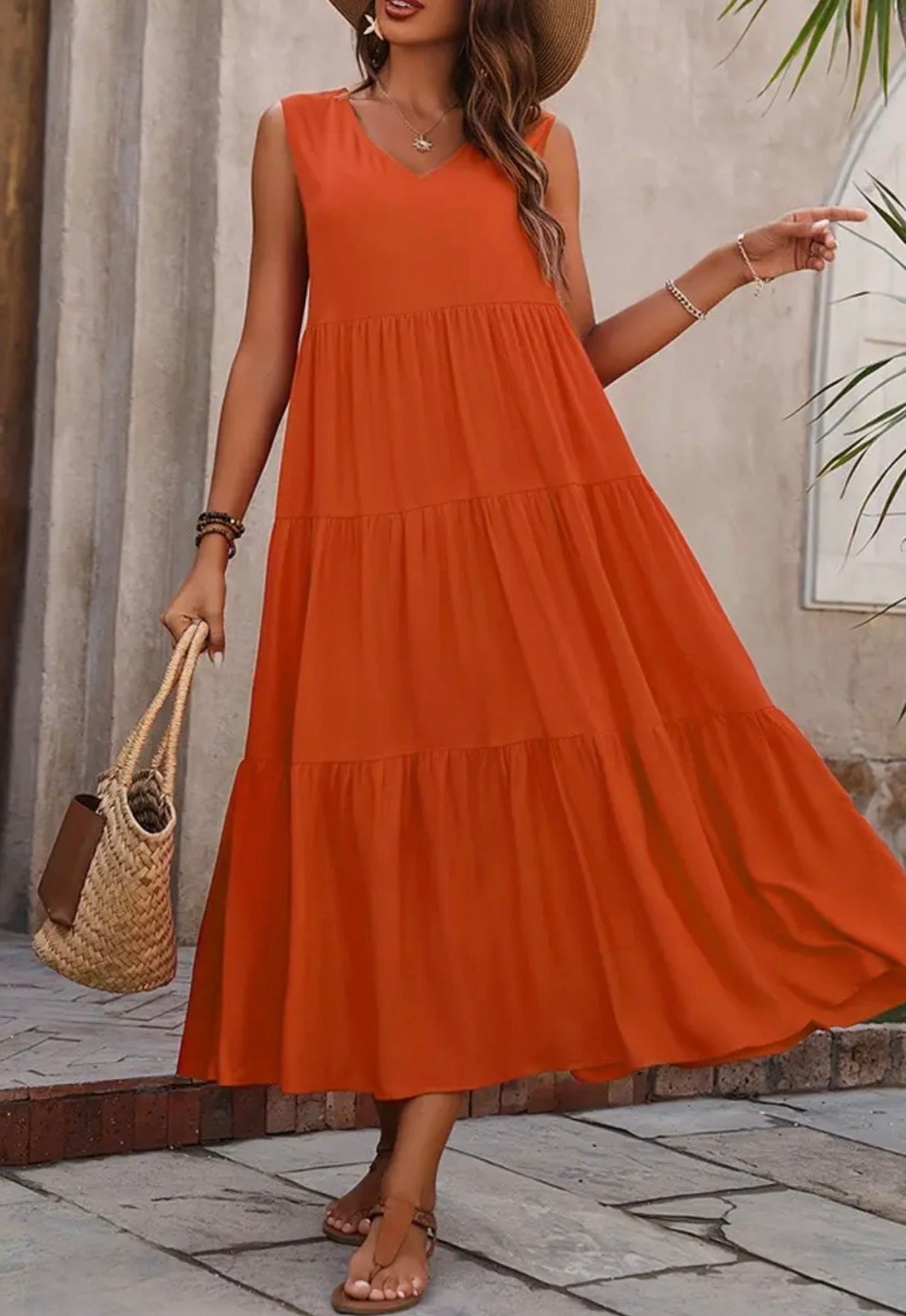 Orange tiered sleeveless dress with mid-length cut from Ivy's Gifts & Boutique, featuring a flowing, tiered design.