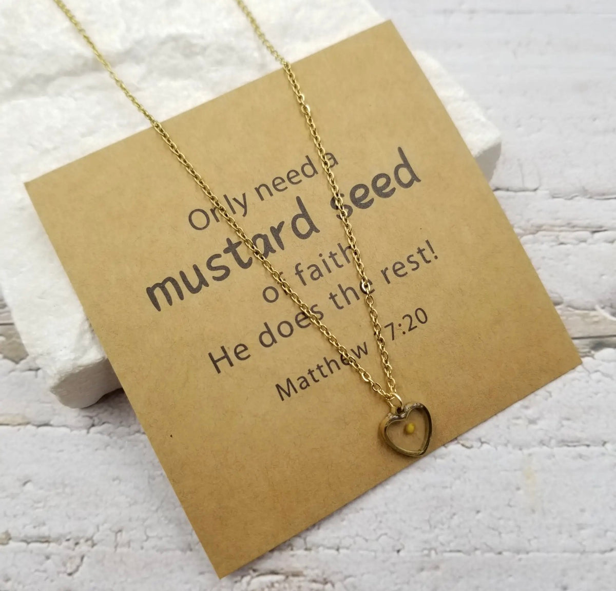 Golden mustard seed heart necklace by Ivy's Gifts & Boutique with sentiment card, featuring a delicate pendant on a fine chain.
