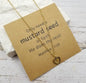Golden mustard seed heart necklace by Ivy's Gifts & Boutique with sentiment card, featuring a delicate pendant on a fine chain.