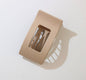 Ivy's Gifts & Boutique FR15 flat safety hair clip showing sleek design and secure grip for stylish, comfortable hair styling.