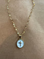 Enamel cross necklace with detailed design, hanging on a chain, crafted by Ivy's Gifts & Boutique.