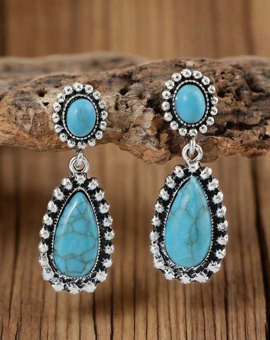 Faux turquoise teardrop earrings by Ivy's Gifts & Boutique featuring vibrant blue stones and silver-tone hooks.