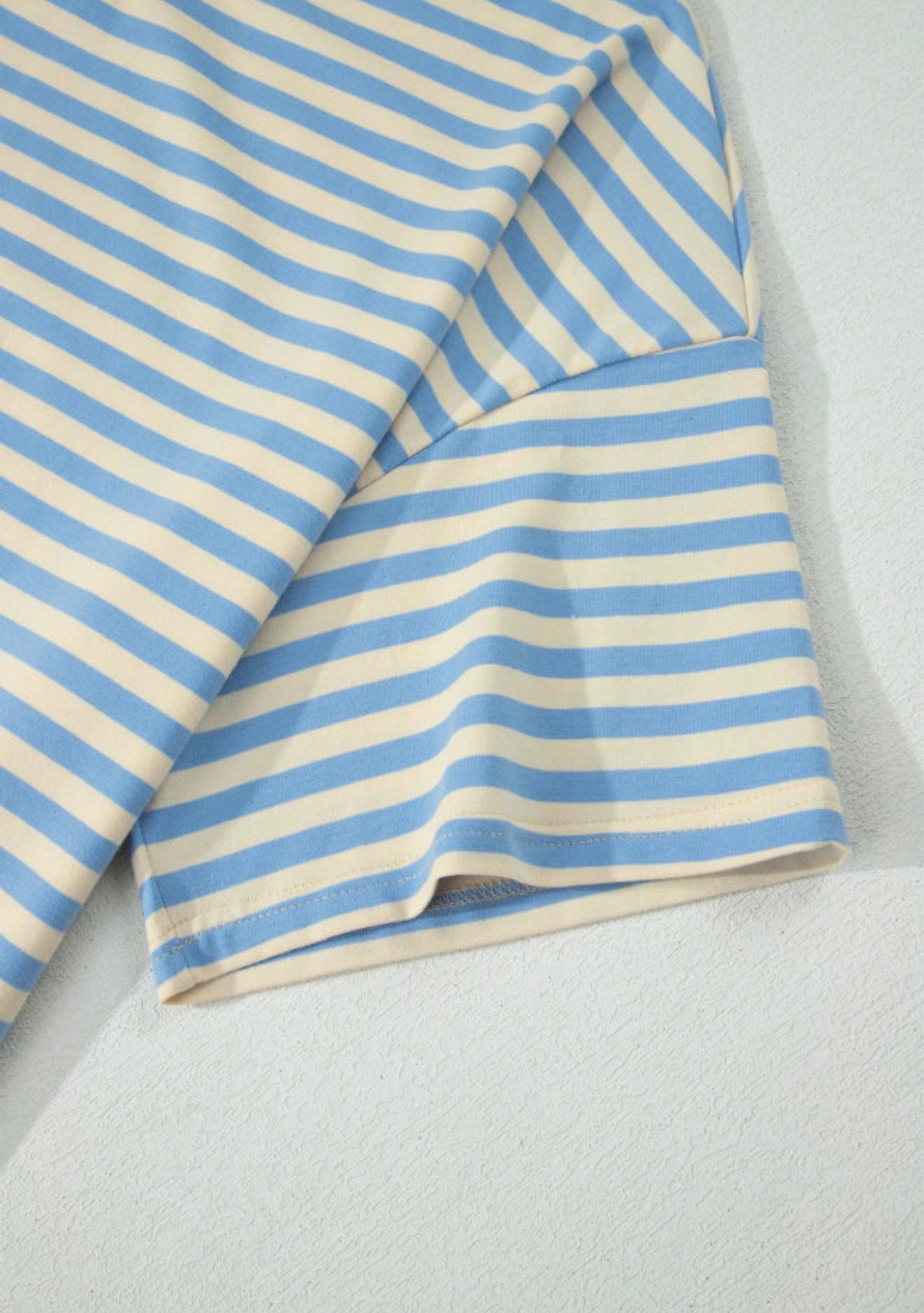 Sky blue drop shoulder stripe top with baby pink contrast trim around the neck by Ivy's Gifts & Boutique