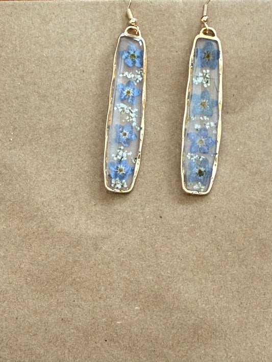 Blue and white dried flower drop pendant, 2.25 inches, from Ivy's Gifts & Boutique, featuring intricate floral details.