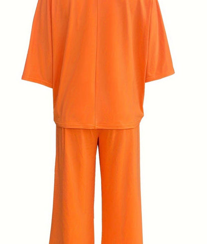 Orange bat wing style 2-piece set by Ivy's Gifts & Boutique, featuring a flowing top and matching skirt with bat wing sleeves.