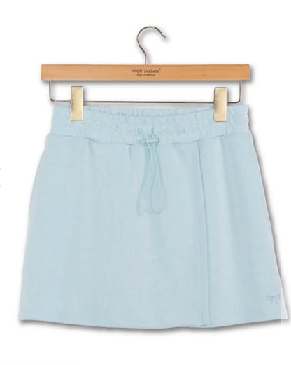 Light blue skort with pockets and drawstring from Ivy's Gifts & Boutique, shown with a comfortable fit and casual style.