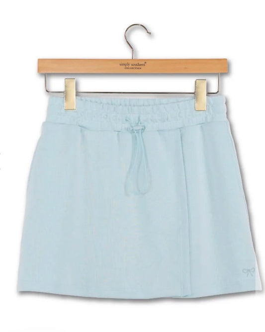 Light blue skort with pockets and drawstring from Ivy's Gifts & Boutique, shown with a comfortable fit and casual style.