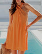Orange sleeveless mini dress with criss-cross neckline from Ivy's Gifts & Boutique, shown on a hanger.