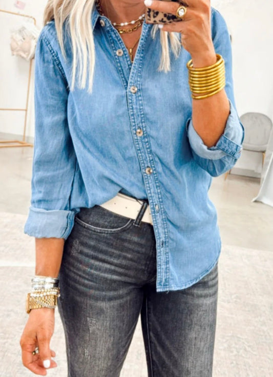 Lightweight denim shirt from Ivy's Gifts & Boutique, featuring a classic cut and light blue wash for a casual look.