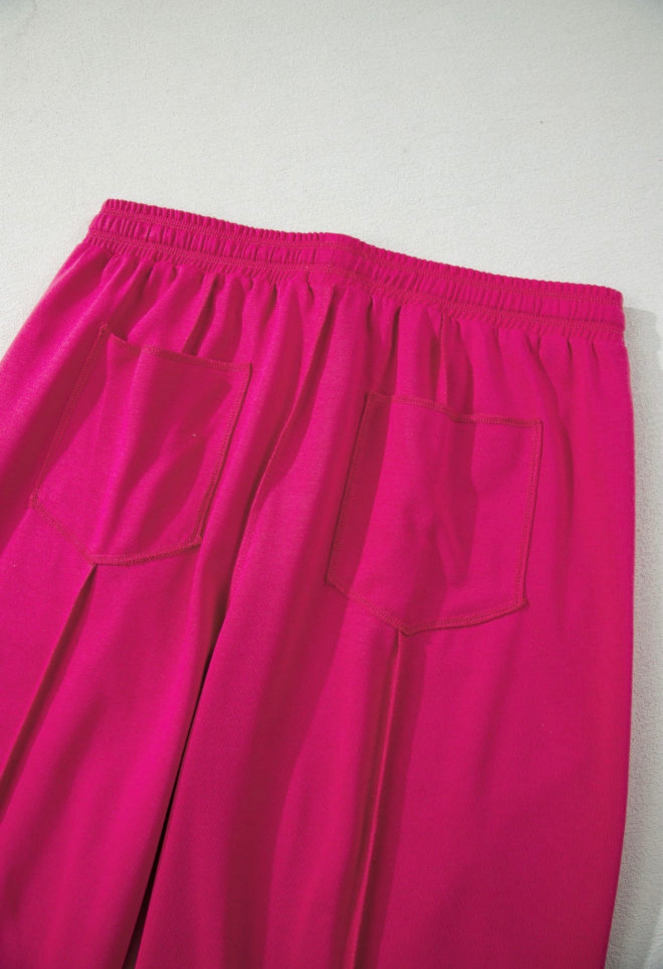 Deep pink dropped shoulder cropped top and elastic waist comfy pants with pockets by Ivy's Gifts & Boutique.