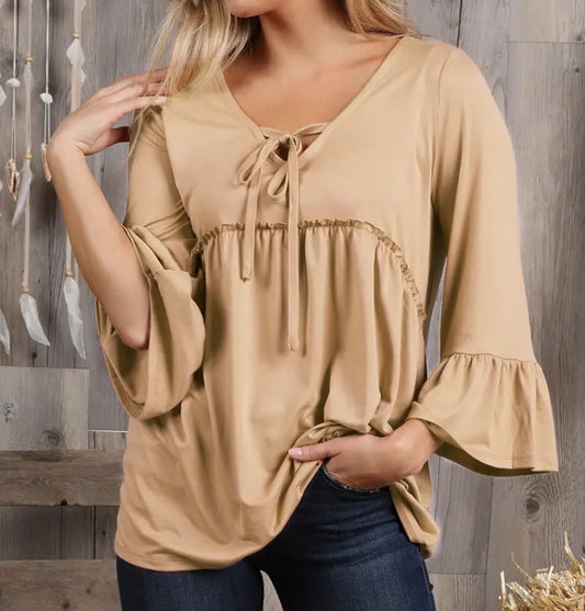 Ivys Gifts & Boutique solid color top with 3/4 length sleeves and string tie neck detail, casual and stylish women's blouse