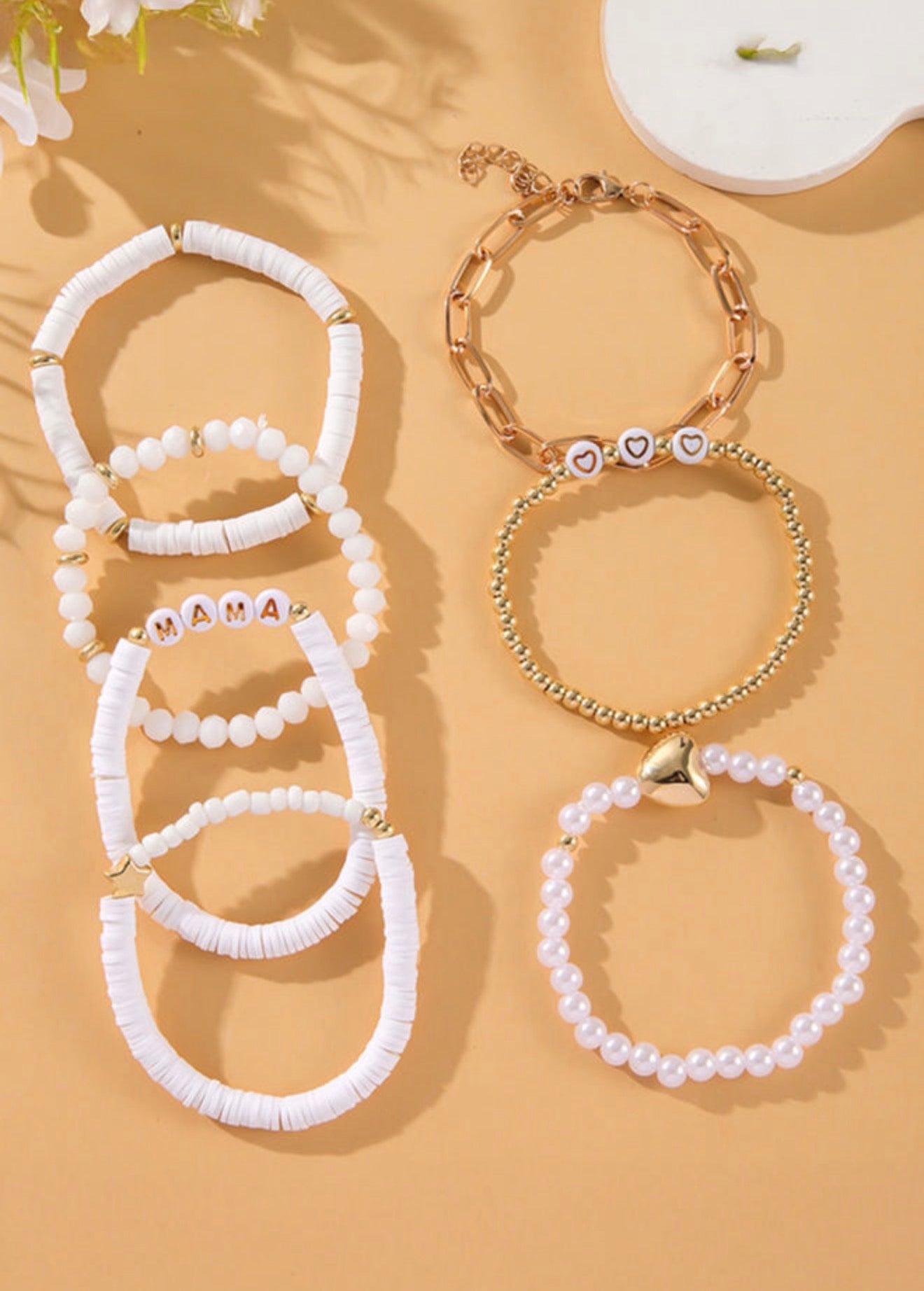Set of seven stackable bracelets from Ivy's Gifts & Boutique's ML19 MAMA jewelry collection, featuring colorful beads and charms.