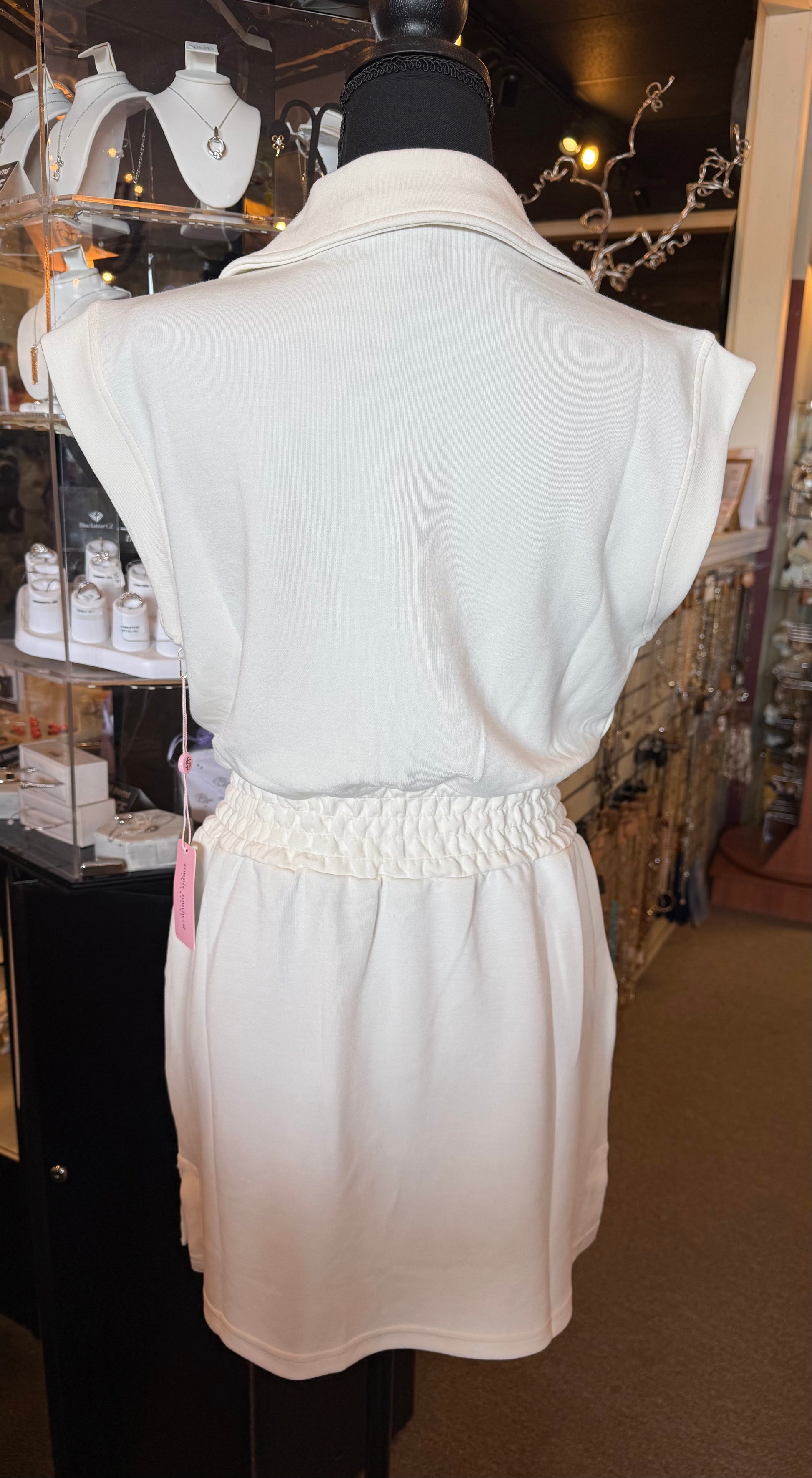 Ivy's Gifts & Boutique SS 49967 cap sleeve mini dress with zip front, drawstring waist, and pockets, shown on a model.