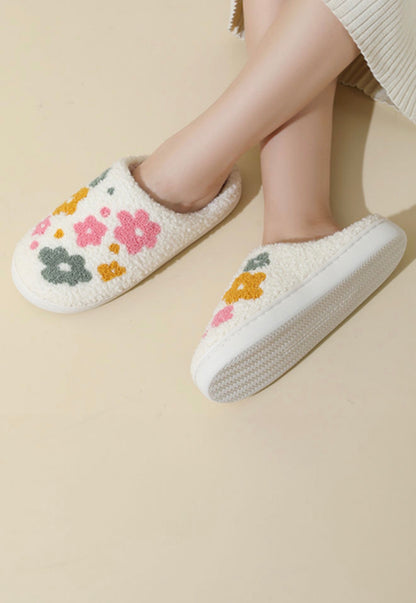 Ivy's Gifts & Boutique ML6 Cozy Fun Daisy Flower House Slippers with colorful daisy patterns and soft fabric for comfortable indoor wear.