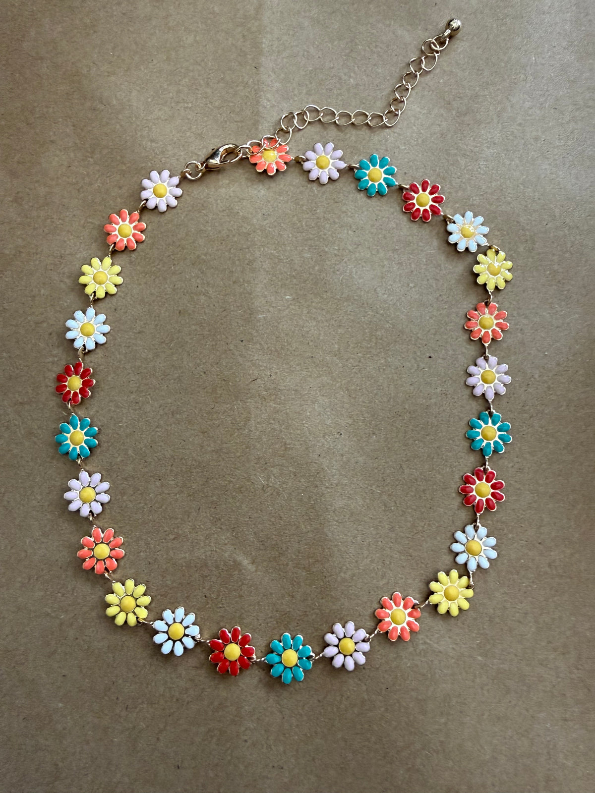 Daisy flower choker necklace from Ivy's Gifts & Boutique featuring delicate white daisies on a black cord.
