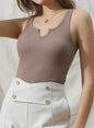Ribbed knit cami tank with notched neckline in neutral color, featuring sleeveless design and fitted silhouette from Ivy's Gifts & Boutique.