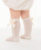 Baby knee socks with bow detail from Ivy's Gifts & Boutique, soft fabric with adorable bow accents for infants.