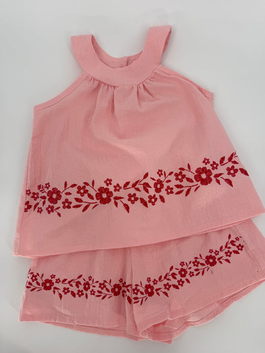 Pink crinkle fabric two-piece short set with red floral accents, by Ivy's Gifts & Boutique, featuring a stylish, casual summer look.