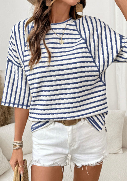 Blue and white striped half sleeve loose top from Ivy's Gifts & Boutique displayed on a neutral background.