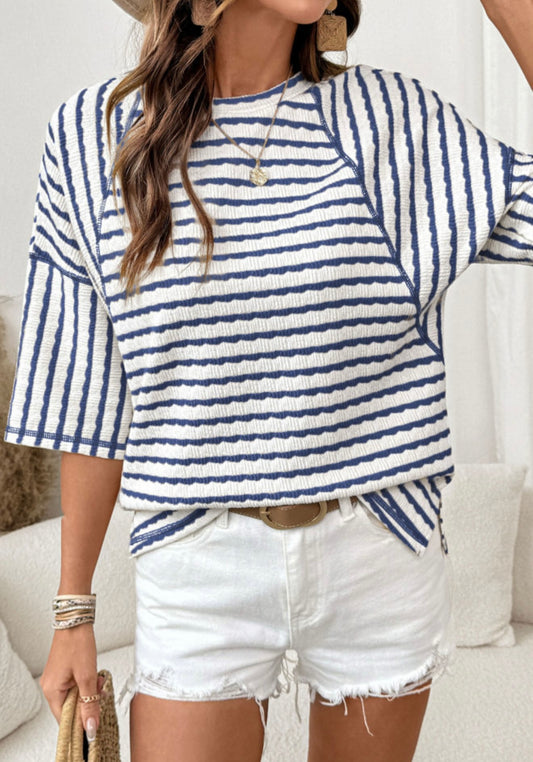 Blue and white striped half sleeve loose top from Ivy's Gifts & Boutique displayed on a neutral background.