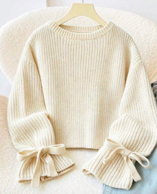 Ivory long puff sleeve sweater with accent bows at the wrists, stylish knit top from Ivy's Gifts & Boutique.