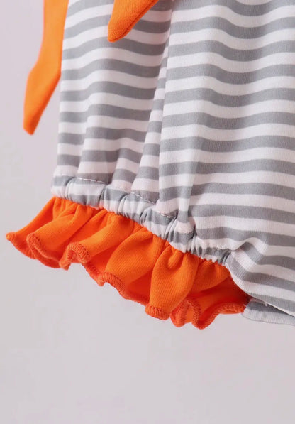 Orange and white baby romper with gray stripe embroidery, side bows, bubble style, by Ivy's Gifts & Boutique.