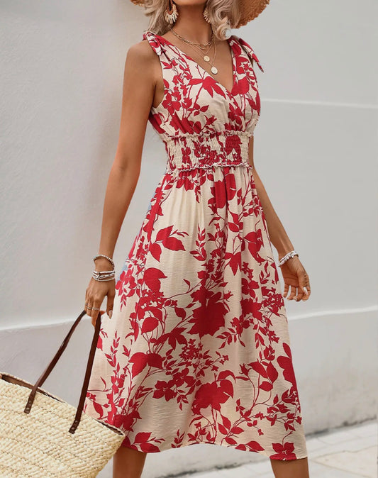 Red floral midi dress with elastic waist from Ivy's Gifts & Boutique, shown on a hanger against a neutral background.