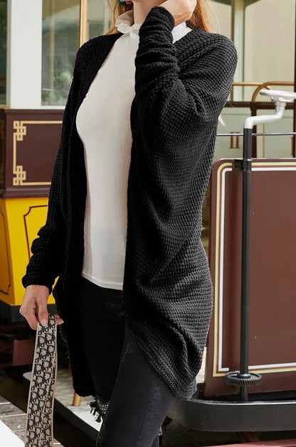Textured fabric open front cardigan with dolman sleeves from Ivy's Gifts & Boutique, shown on a model.