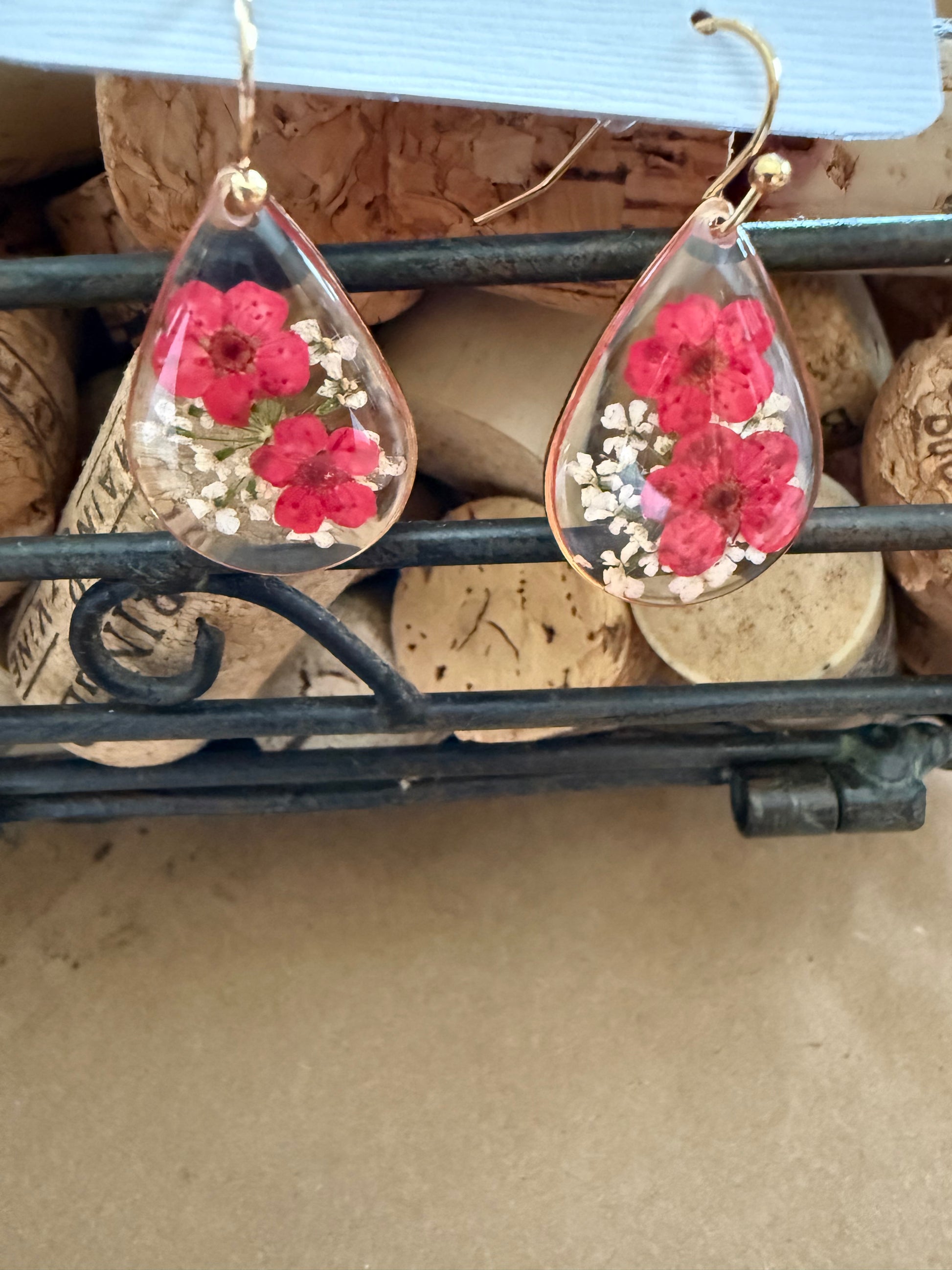 Dried flower earrings by Ivy's Gifts & Boutique featuring delicate floral design and gold-tone hooks.