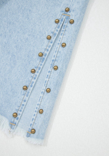 Light wash wide-leg jeans with frayed hems, side splits, and studded accents from Ivy's Gifts & Boutique.