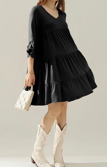 Black 3-tier dress with 3/4 sleeves and ruffle hem from Ivy's Gifts & Boutique, styled on a mannequin.