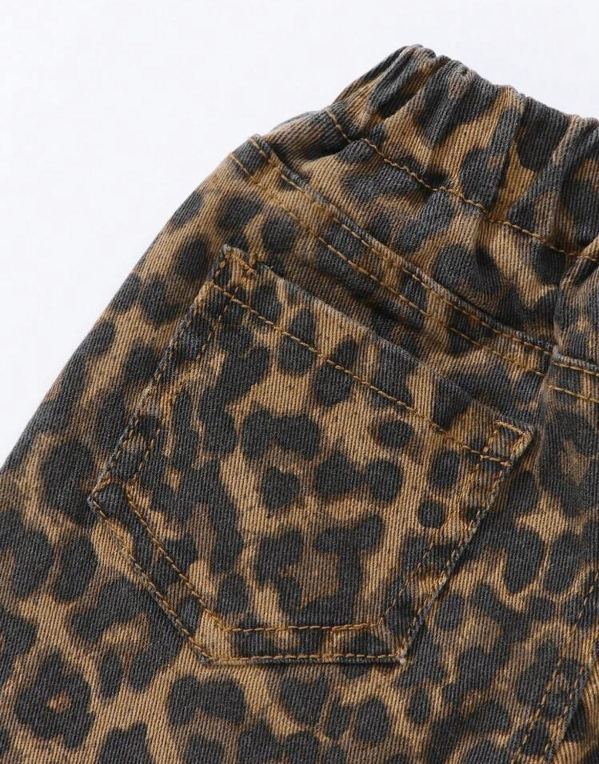 Animal print jeans with elastic drawstring waist, front and back pockets, by Ivy's Gifts & Boutique.