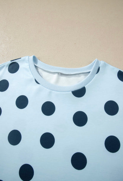 Light blue polka dot 2-piece short set for kids by Ivy's Gifts & Boutique, featuring a short-sleeve top and matching shorts.