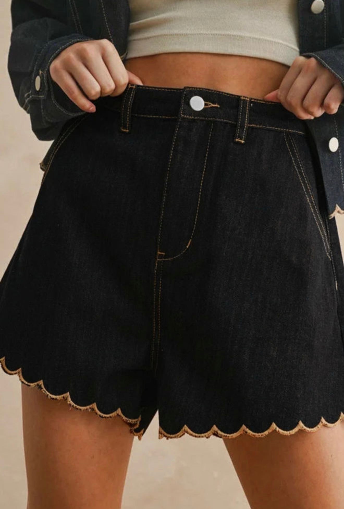 Black stretch denim scallop hem shorts from Ivy's Gifts & Boutique, featuring a stylish scalloped edge and fitted waist.