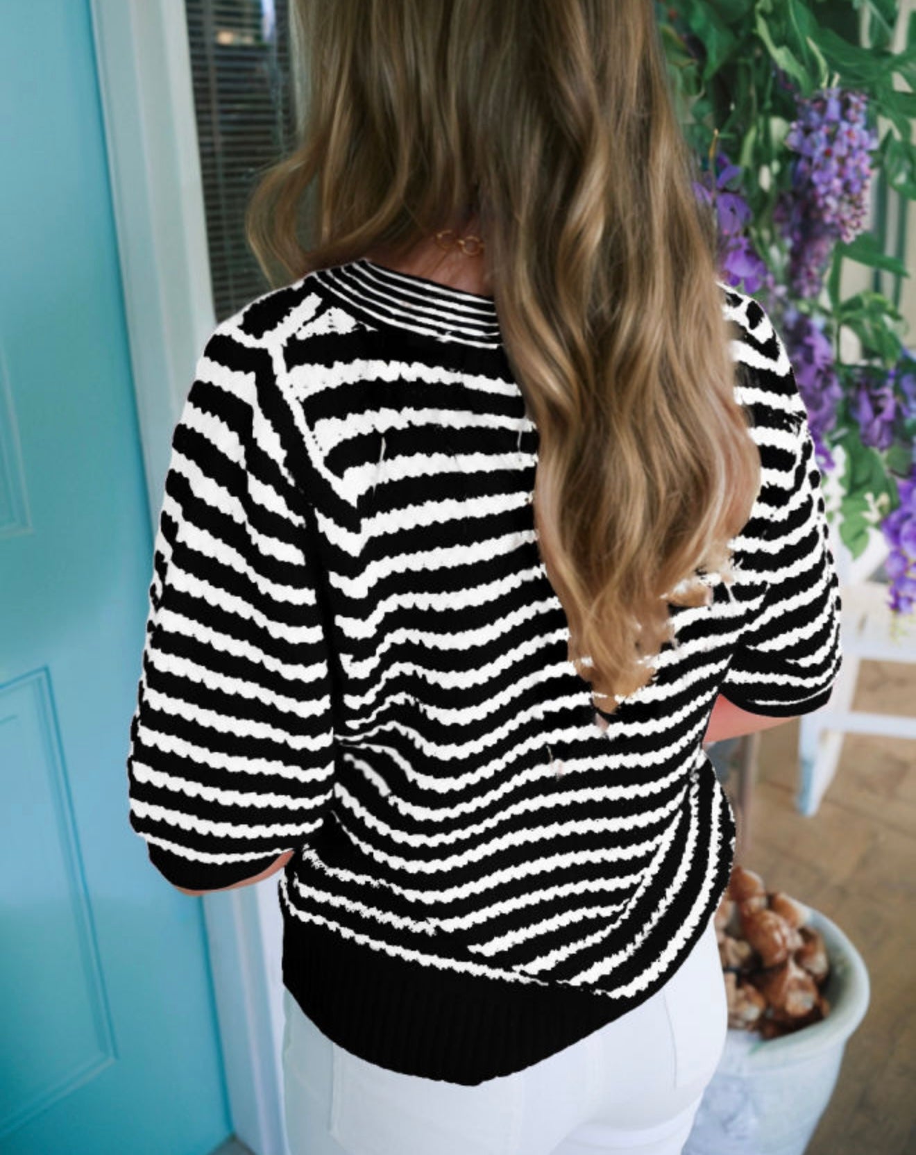 Black and white short sleeve sweater by Ivy's Gifts & Boutique, featuring a stylish knit design and relaxed fit.