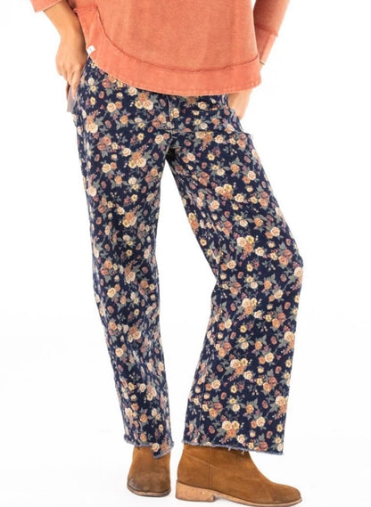 Floral stretch denim raw edge hem pants by Ivy's Gifts & Boutique featuring a fitted style and floral print design.