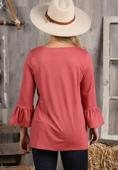 Ivy's Gifts & Boutique solid color top with 3/4 sleeves and string tie neck detail, shown on a hanger.