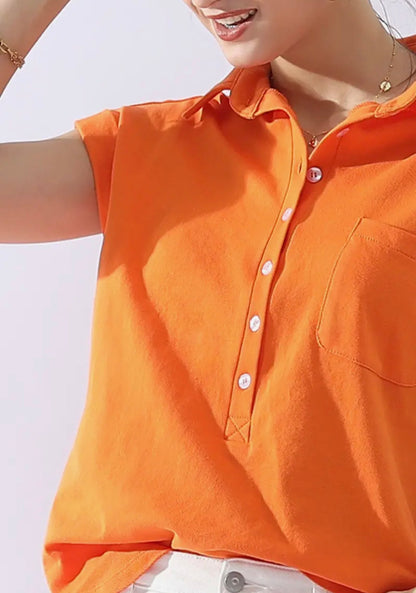 Orange collar shirt by Ivy's Gifts & Boutique with half-button neck and front pocket, made of 100% cotton fabric.