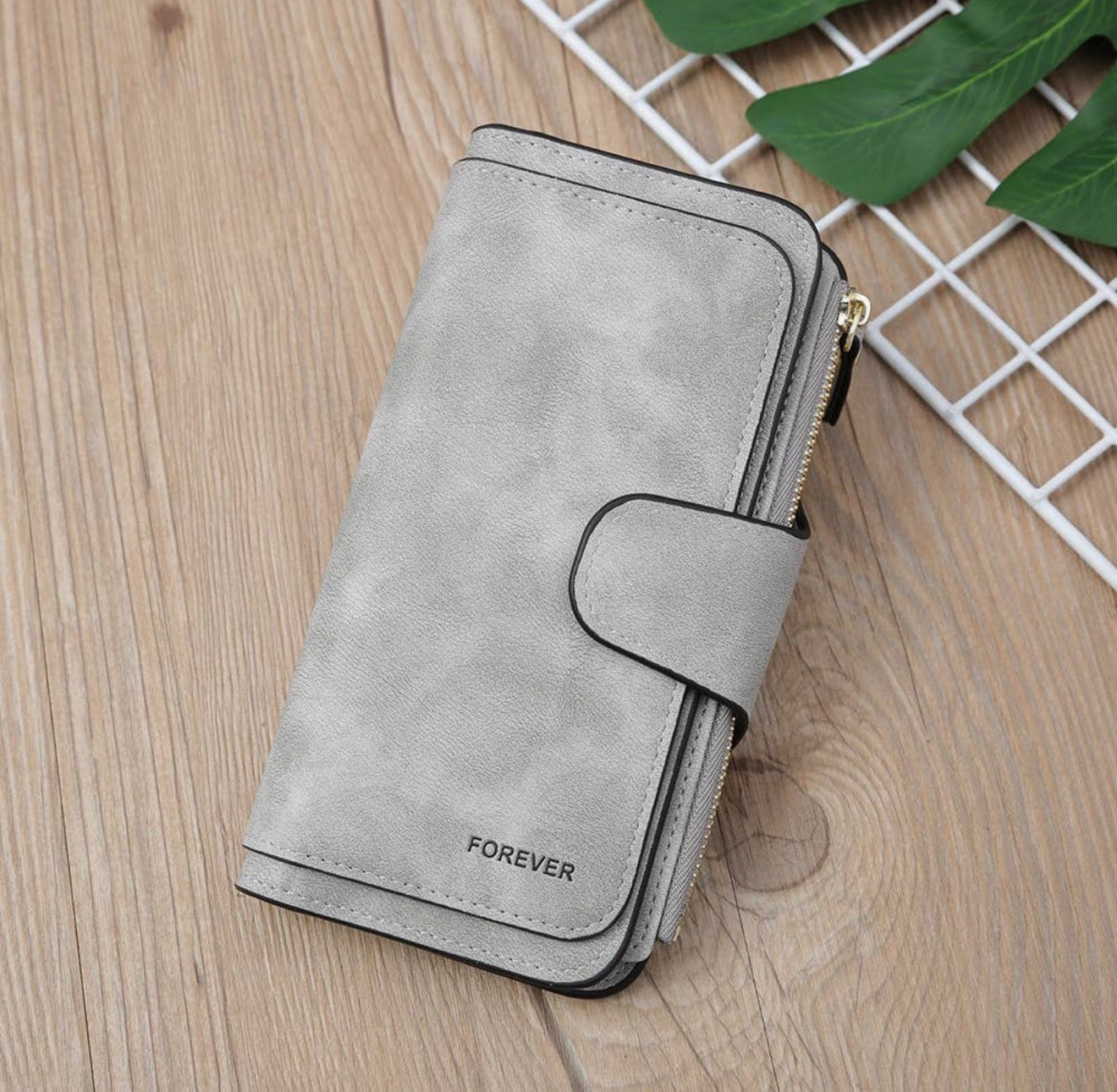 Vegan leather women's wallet with zip coin pouch, multiple card and ID slots, in black, from Ivy's Gifts & Boutique.