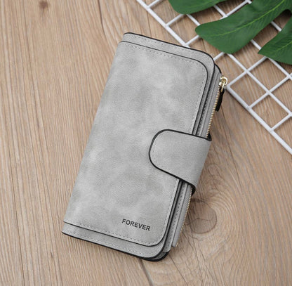 Vegan leather women's wallet with zip coin pouch, multiple card and ID slots, in black, from Ivy's Gifts & Boutique.