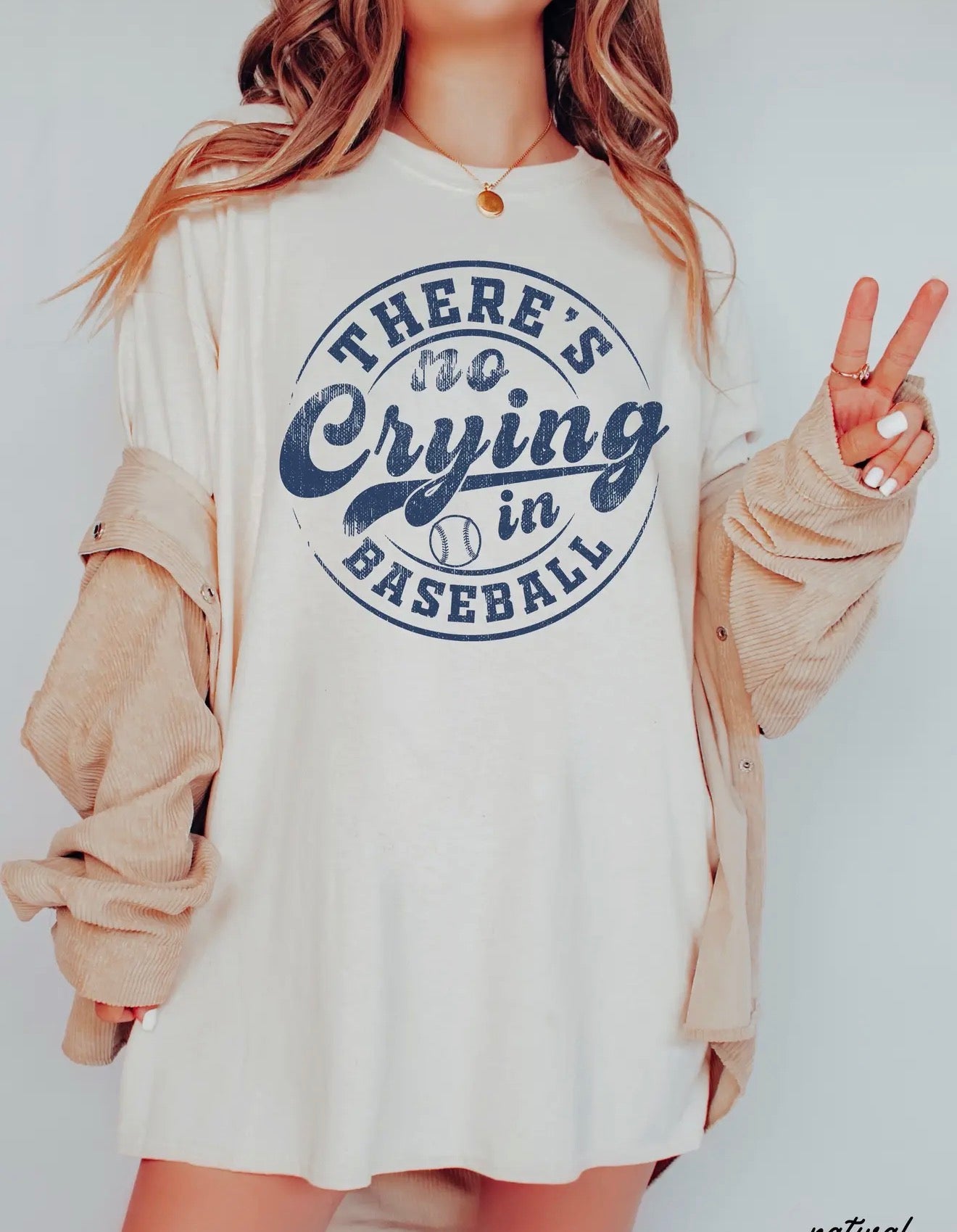 Ivy's Gifts & Boutique No Crying In Baseball T-Shirt featuring bold text on a casual fit tee in a vibrant color.