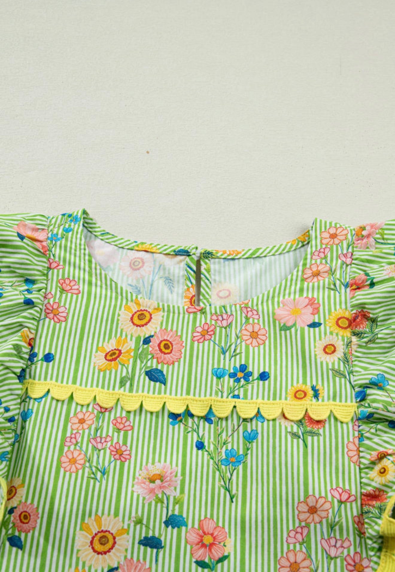 Green floral summer top with ruffled cap sleeves and ric rac trim by Ivy's Gifts & Boutique