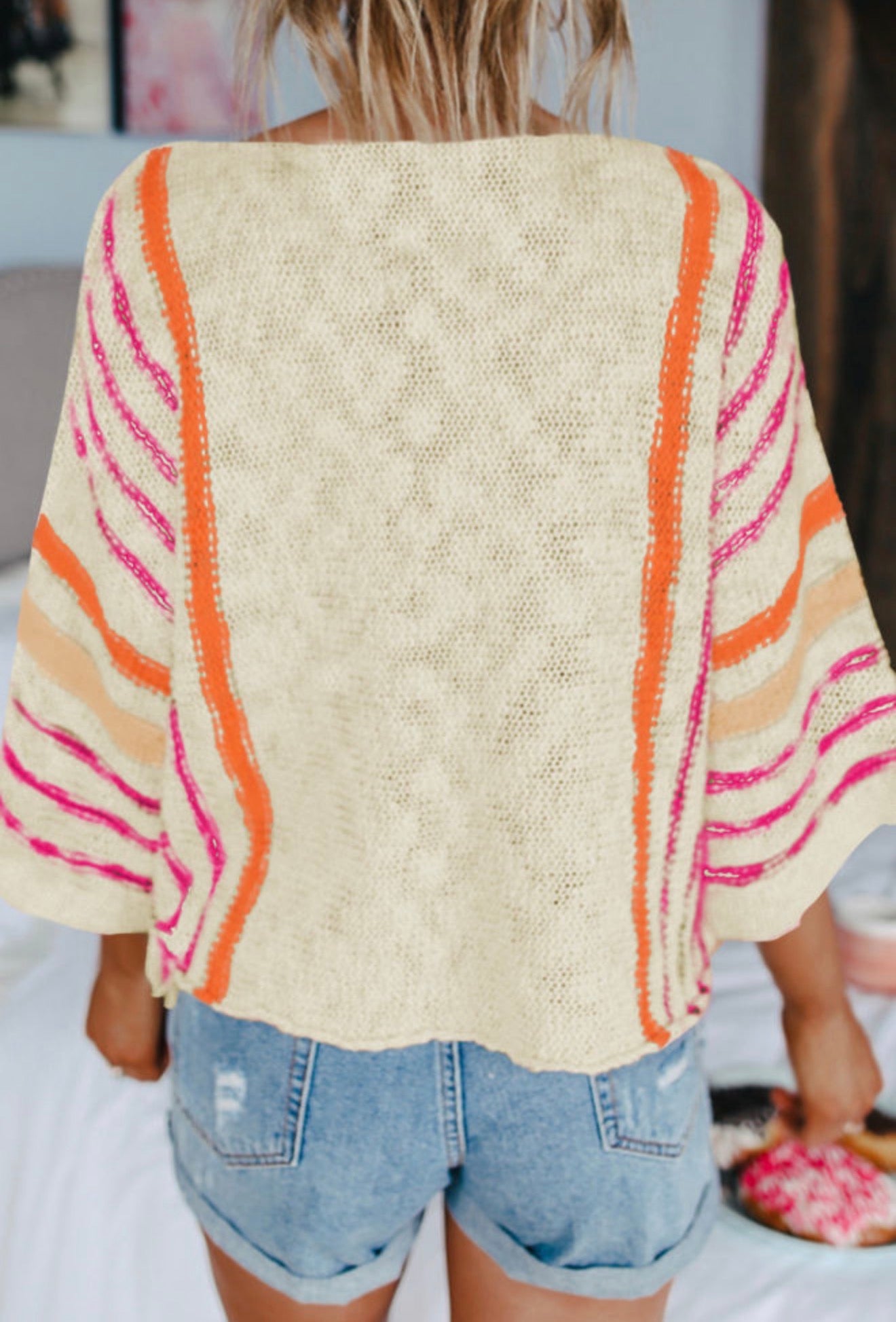 Lightweight summer sweater by Ivy's Gifts & Boutique with orange and pink stripes, size small, displayed flat on a white background.