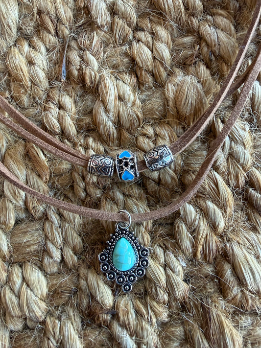 Double strand faux turquoise necklace by Ivy's Gifts & Boutique, featuring vibrant blue beads and silver-tone accents.